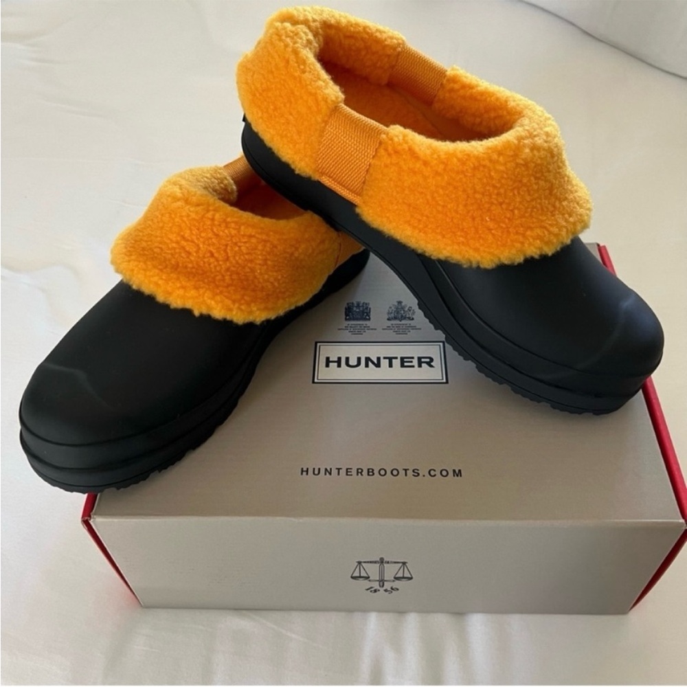 Hunter Black and orange clogs. NWOT includes box
